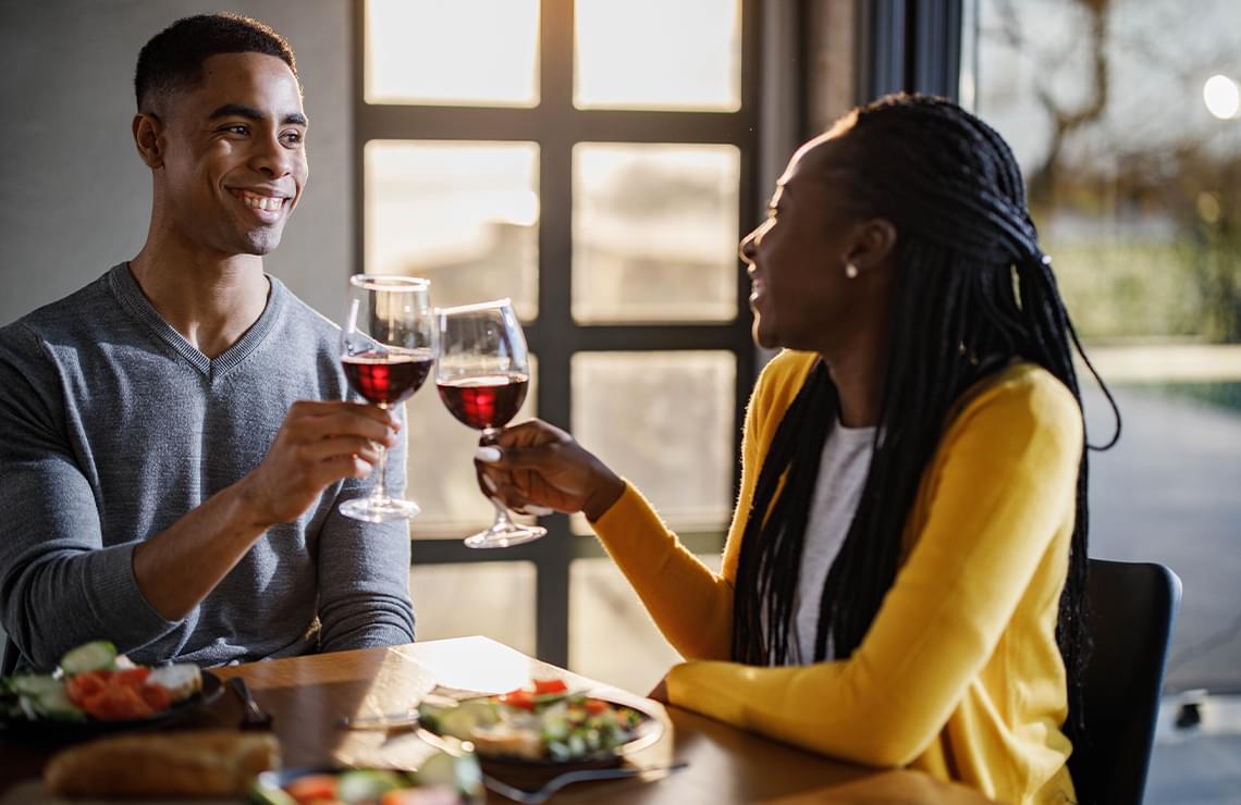 Man and woman having wine together