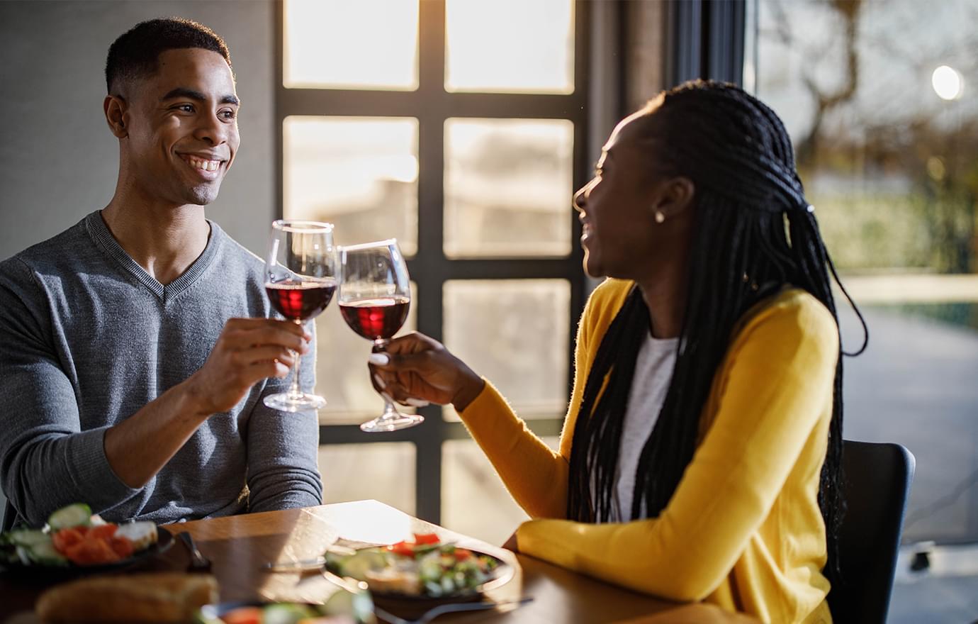 Man and woman having wine together